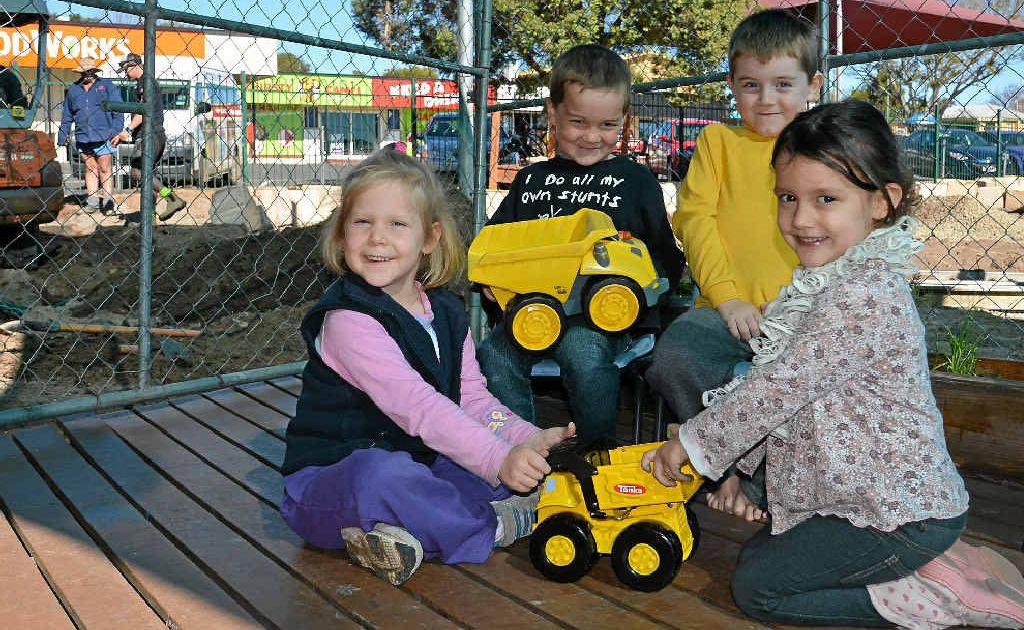 William Sollars, Tom Beverage, (front) Jayda Williams and Millie Williams think the bobcats and machinery working on their new playground pretty cool.